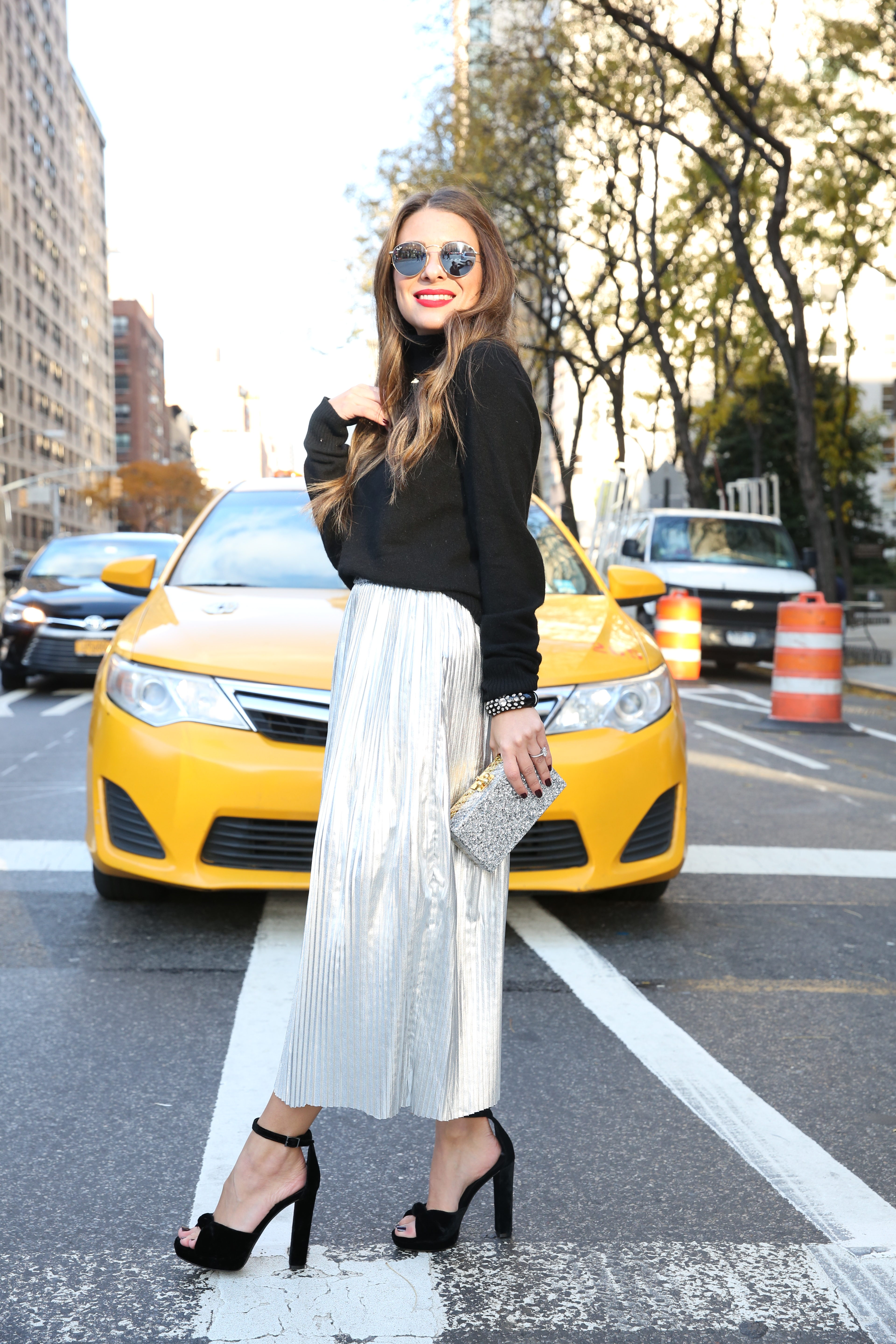 Arianna of Blake and Gold in a silver H&M skirt for the holidays